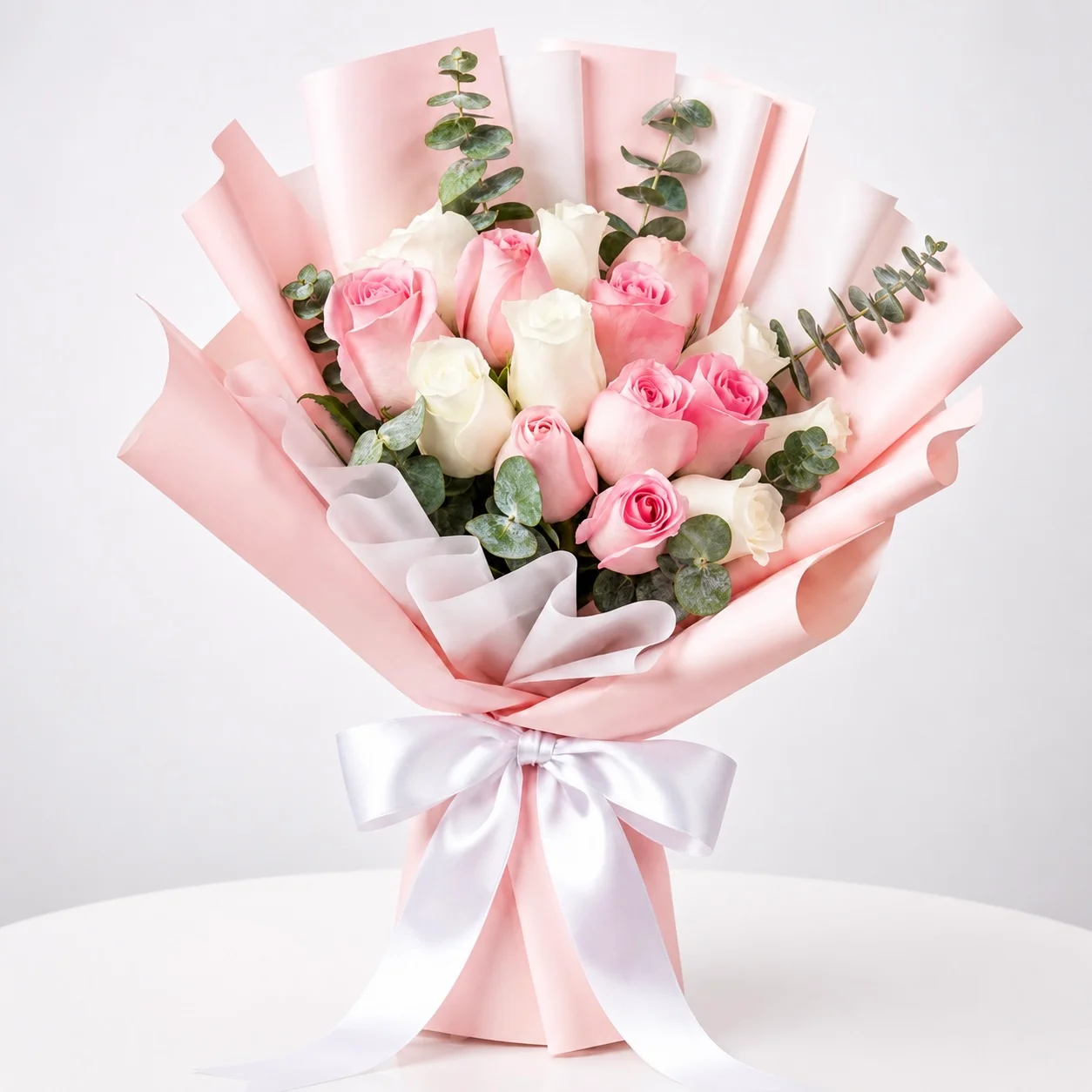 Blush and Bloom 15 pink and white rose bouquet beautifully wrapped for Girlfriend's Day and romantic flower gift delivery